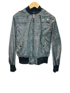 Modify Thrift vintage Coach hooded bomber jacket with a teal, pink, and olive ditsy floral print and ribbed trim.