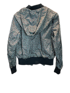 Modify Thrift vintage Coach hooded bomber jacket with a teal, pink, and olive ditsy floral print and dark ribbed trim.