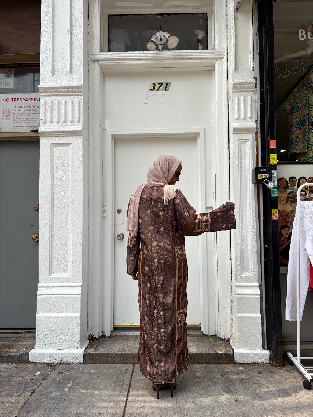 Modify Thrift chocolate brown silk-satin maxi dress with gold vine embroidery and long sleeves worn with a headscarf