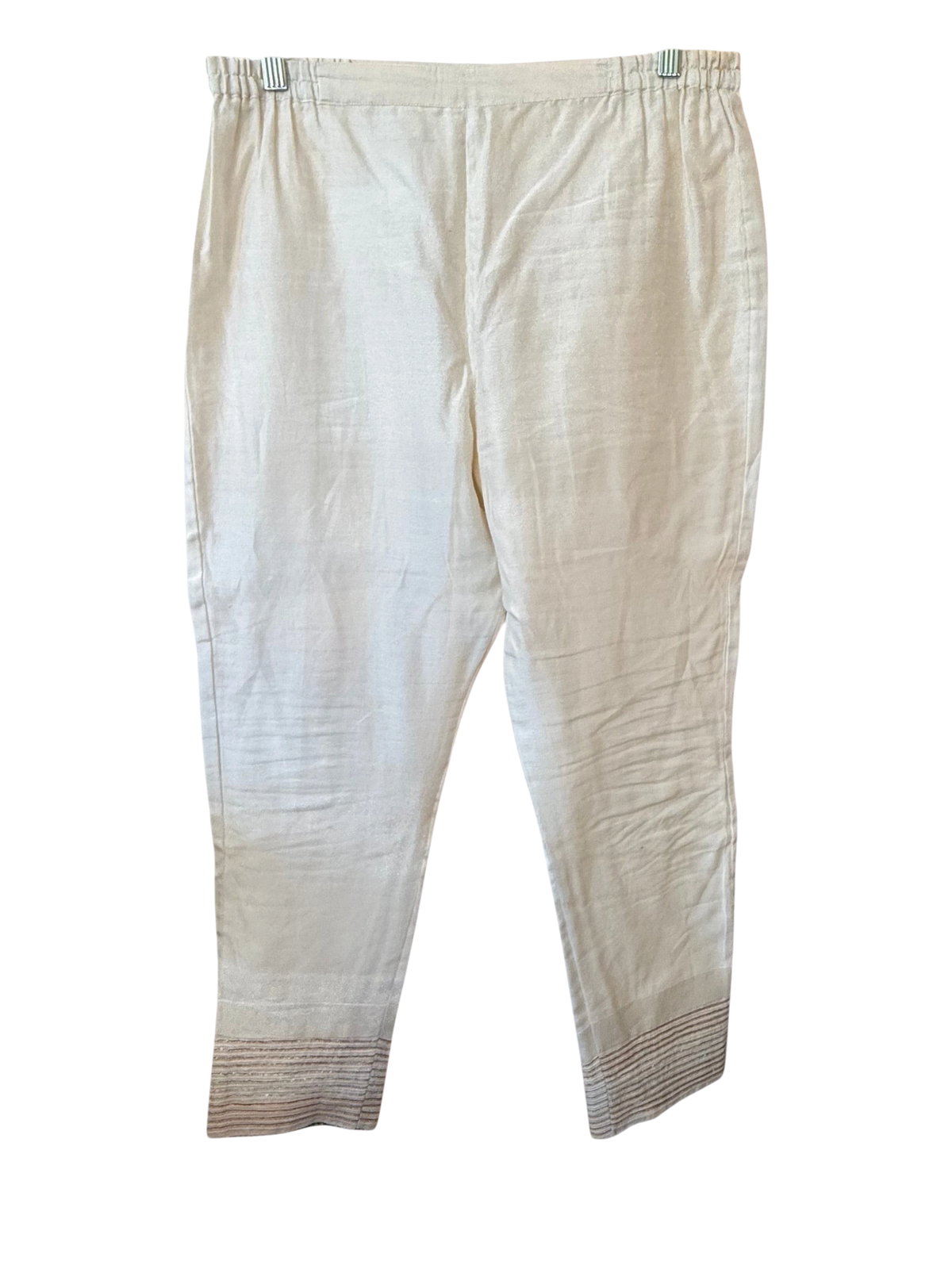 Modify Thrift cream cotton cropped trousers with embroidered cuffs and elasticized waistband hanging on a rack